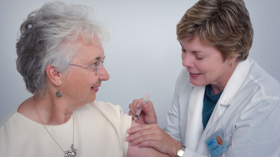 stressed family caregiver caring for senior parent at home